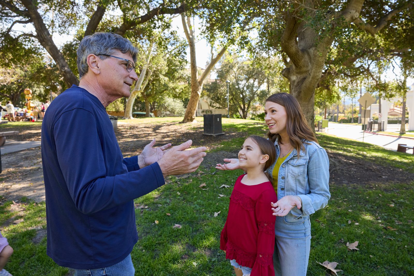 Scott speaking with a mom and her daughter about education